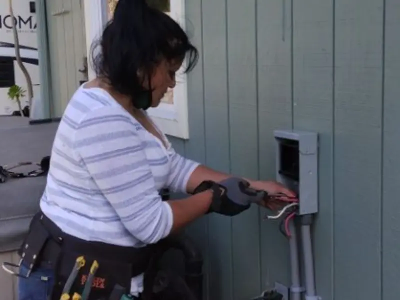 Licensed electrician wiring an exterior subpanel in Salinas