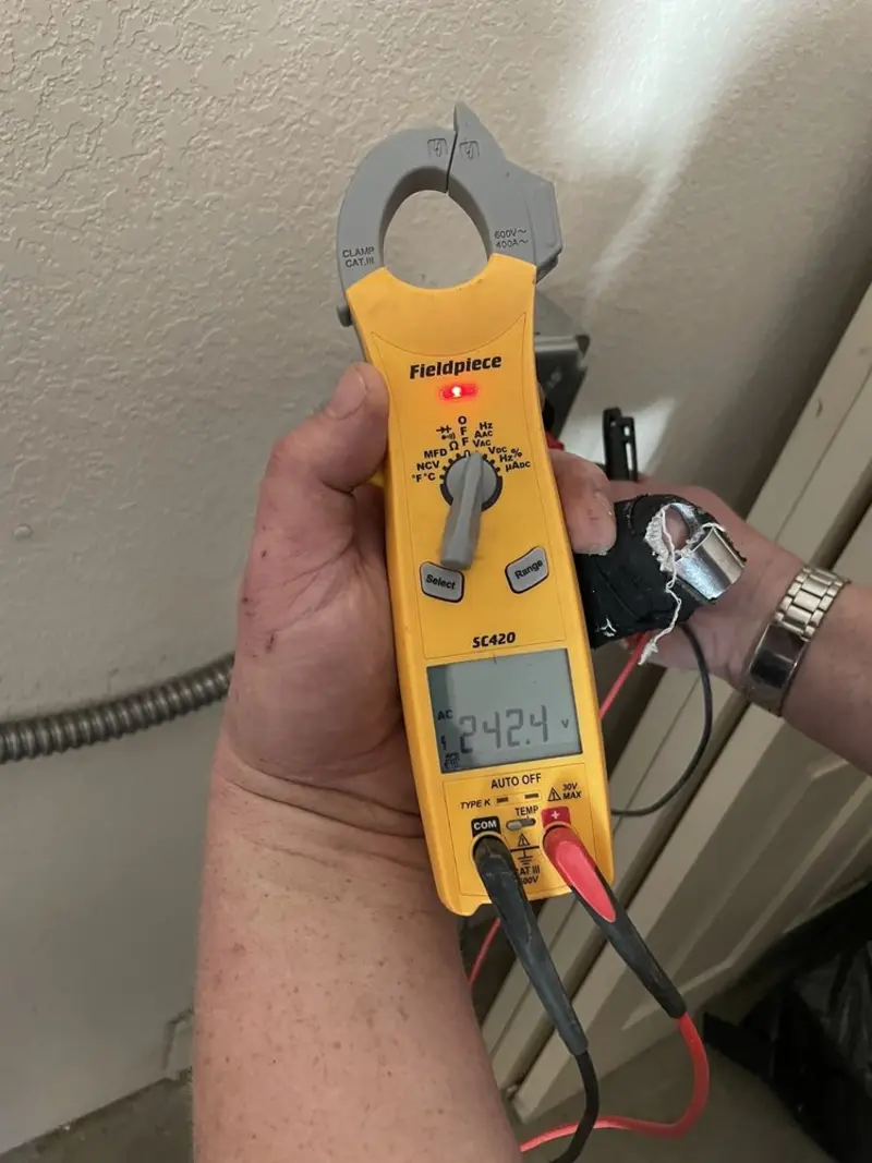 Voltage testing with clamp meter during Electrical Installation Services in Salinas